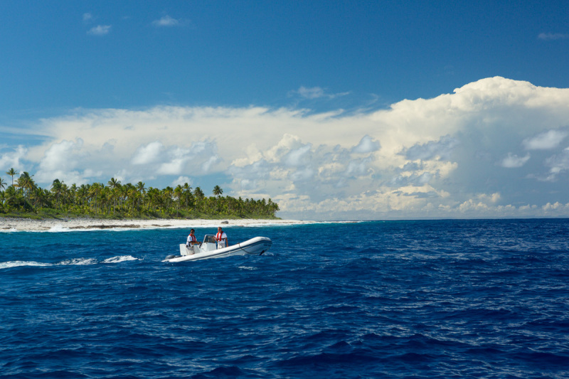 Small skiff from M/Y Golden Shadow with island background.