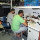 Thomas Cribb and Pierre Sasal working in the lab aboard the Golden Shadow.