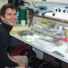 Erwan Delrieu-Trottin worining in the lab aboard the Golden Shadow.