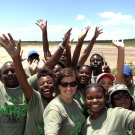 Students at Abaco Central High School and our Director of Education, Amy Heemsoth (center) celebrate restoring the mangrove ecosystem at Camp Abaco.