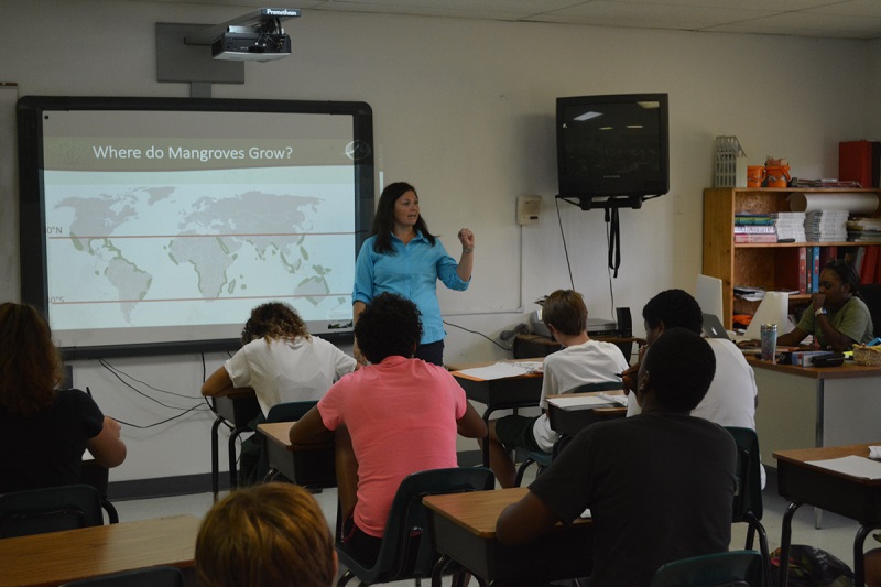 Our Director of Education, Amy Heemsoth teaching 10th grade Biology students about the basics of mangroves at Forest Heights Academy.