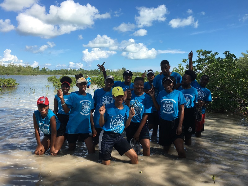 Students at Abaco Central High School pose with their mangrove propagules that they will soon be planting.