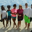 After getting a little muddy in the mangroves, students rinse off in the ocean.