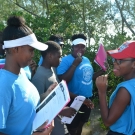 Students from Abaco Central High School hesitantly taste the black mangrove leaf only to find out that they are very salty.