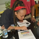 During the second year B.A.M. program, students will test several non-living factors in their mangrove plots. Here students are practicing using pH test strips.