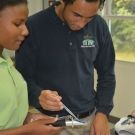 Marine Biology students at Forest Heights Academy test the salinity (salt content) of various types of liquids.