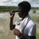 B.A.M. second year student reads the salinity of the mangrove ecosystem using a refractometer.