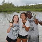 4.	Students from Forest Heights Academy show off the mangrove propagules they have collected for their class project.