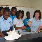 8.	Back in the classroom, KSLOF Education Director Amy Heemsoth instructs students on the proper way to plant mangrove propagules.