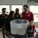 Forest Heights Academy students are excited to see a pufferfish. The next step is for them to use books to identify the species.