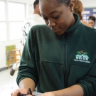 An inquisitive student at Forest Heights Academy observes the behavior of a sea star. She had many questions for us.