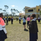 Students in the year one B.A.M. program at Abaco Central High School form a giant food web. Each student respresents an organism from the mangrove food web.