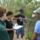 Forest Heights students record their data in the mangrove journals.