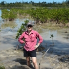 Mangrove scientist, Ryann Rossi, posing with the specimens that she studies - mangroves.