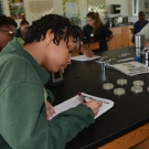 Before the students begin the disease activity, Ryann Rossi provides a short presentation about the mangrove disease, the types of disease, and how they plants can contract disease. During the presentation, students take notes in their Mangrove Journals.