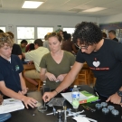 Students at Forest Heights Academy further sterilize the mangrove leaf isolations by placing them in a bleach solution for several seconds before transferring them to their agar plate.