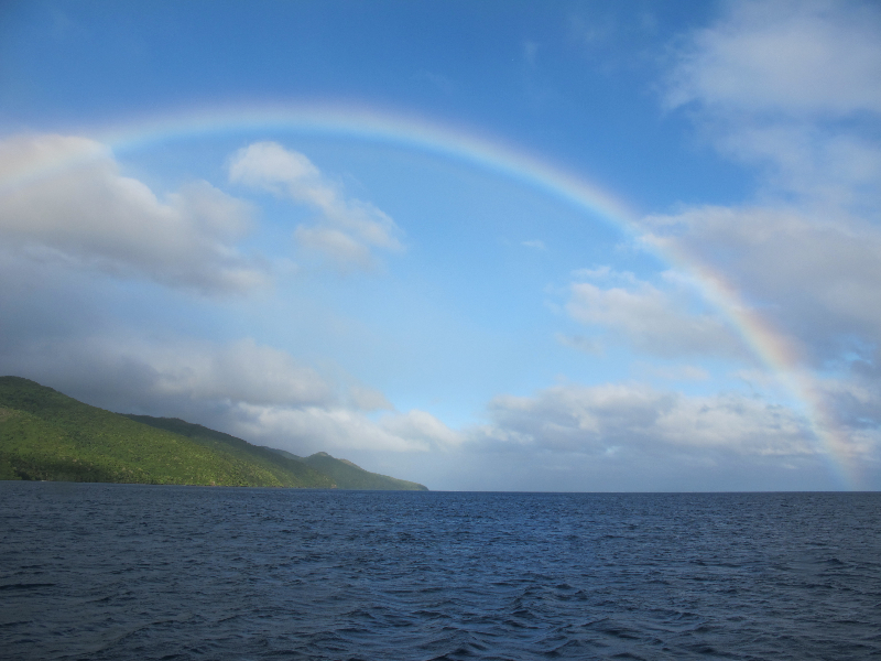 A beautiful rainbow stretching across one of the islands of Fiji.