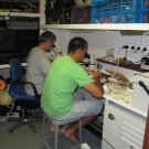 Members of the science team work in the lab aboard the M/Y Golden Shadow.