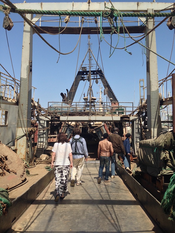 Exploring the giant commercial fishing vessels at the Port of Dakar.