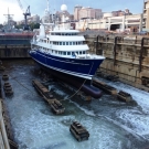 Early in the morning a final dock bottom inspection is completed.  The valves are then opened and the water begins to flood into the dock basin.