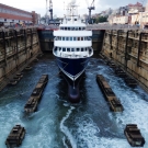 The floating process in carried out in stages. At each stage, inspections inside the vessel are completed to ensure all of the hull valves are holding and that there are no leaks. Once the Chief Engineer has reported everything is satisfactory, they continue to flood the basin until Shadow floats. Mooring ropes attached to the dock sides keeps the vessel in position. The whole process takes about 3hrs before the water is at the same level as the water in Sydney harbor.
