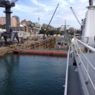 3 hours after the valves were open to flood the basin, the Shadow is tied up alongside.  This view shows the middle dock gate where an Australian naval vessel is undergoing repairs.