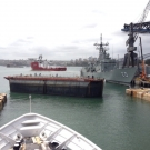 Tugs tow the Caisson away and the dock is now open to Sydney harbor.