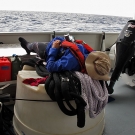 Abby Cannon catching 40 winks on the aft deck of the Shadow while waiting to load the dive boats for our morning dives.