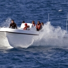 Survey divers returning on the Leisure Cat at the end of the day.