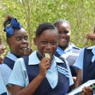 Jamaican high school students taste the saltiness of mangrove leaves as part of the Jamaican Awareness of Mangroves in Nature (JAMIN) project.
