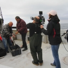 Carl Hedderson shows off his catch to fisheries scientist Daniel Pauly