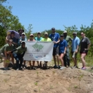 Partners from the University of the West Indies and the Living Oceans Foundation celebrate a day of hard with with volunteer alumni from Louisiana State University.