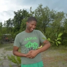 William Knibb High School student cradles his mangrove propagule signifying all of the hard work that went into caring for this seedling.