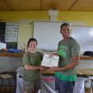 Amy Heemsoth, the Foundation's Director of Education, proudly hands out certificates of partipation to the students at William Knibb High School