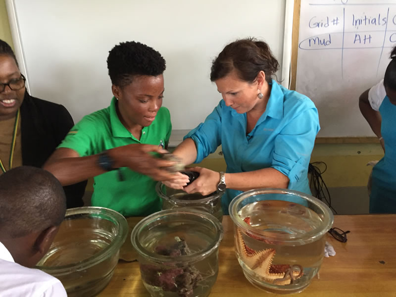 Shanna Thomas, University of the West Indies and Amy Heemsoth, Living Oceans Foundation work together to teach students about the animals and plants that are a part of the mangrove ecosystem.
