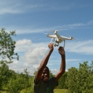 Student from William Knibb High School assists with the recovery of the drone.