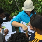 Students from Marcus Garvey put STEAM into action as they draw and label the different species of mangrove leaves. Director of Education, Amy Heemsoth helps to guide this process.