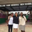 Shanna Thomas (Outreach Officer, University of the West Indies), Amy Heemsoth (Director of Education, Living Oceans Foundation), and Fulvia Nugent (Science Teacher, William Knibb High School) stand at the entrance of the school.