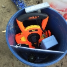 J.A.M.I.N. year two students use various scientific tools to monitor their mangrove quadrats. Each group gets a bucket which includes various tools such as refractometers, pH strips, thermometers, and soil corers.