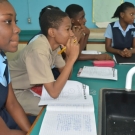 Holland High School grade 10 biology students concentrate on listening to a presentation about mangrove food webs.