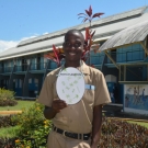 10th grader at Holland High School pretends to be phytoplankton (a plant-like plankton) during a food web activity.