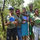 Students work as teams to set up and monitor their mangrove quadrats. This team from William Knibb High School is ready to collect some data.