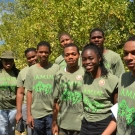 Fulvia Nugent proudly helps this group of students monitor their mangroves. This is the second year in a row that these students from William Knibb have partipated in the J.A.M.I.N. program.
