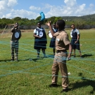 Students use yarn to create a mangrove food web or a series of interconnected food chains.