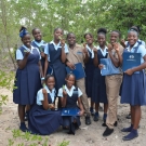 Students show off mangrove leaves they collected.