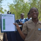 A student shows off his sketch of a mangrove leaf.