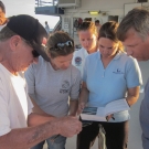 Many members of the Science team look up a fish species.