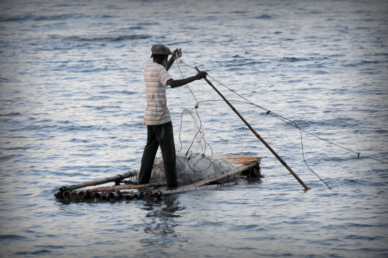 jamaaA man fishing from his raft in Jamaica.can-man-fishing-from-his-raft-at-pedro-bank