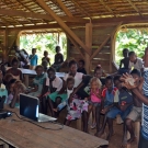 During an LOF education program, Ivory Akao, Fisheries Officer, explains that corals produce a skeleton made of calcium carbonate.