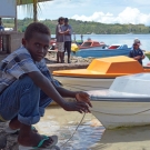 Young man hanging out near the fish market in Ghizo Island.